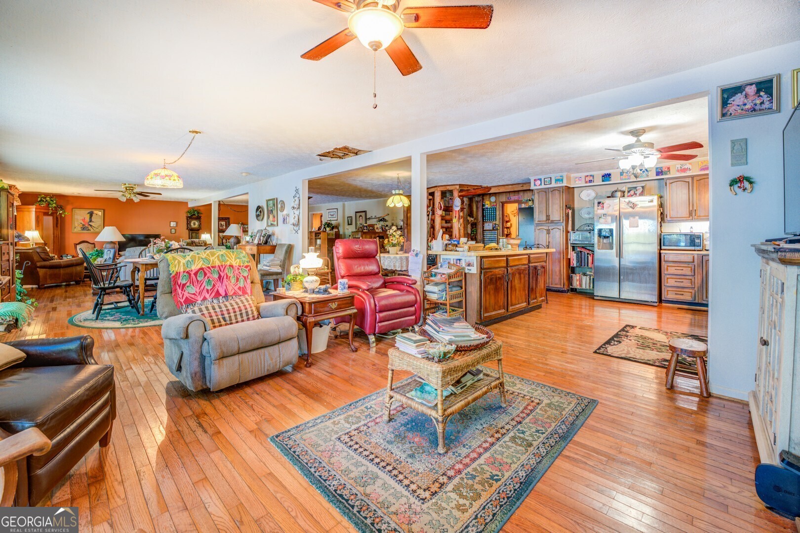 766 Raven Road Monticello, GA 31064 - Photo 32 of 59 a living room filled with furniture and a wooden floor