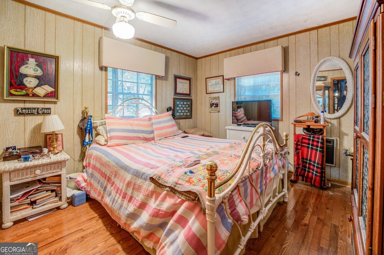 766 Raven Road Monticello, GA 31064 - Photo 34 of 59 a bedroom with a bed a dresser next to a window