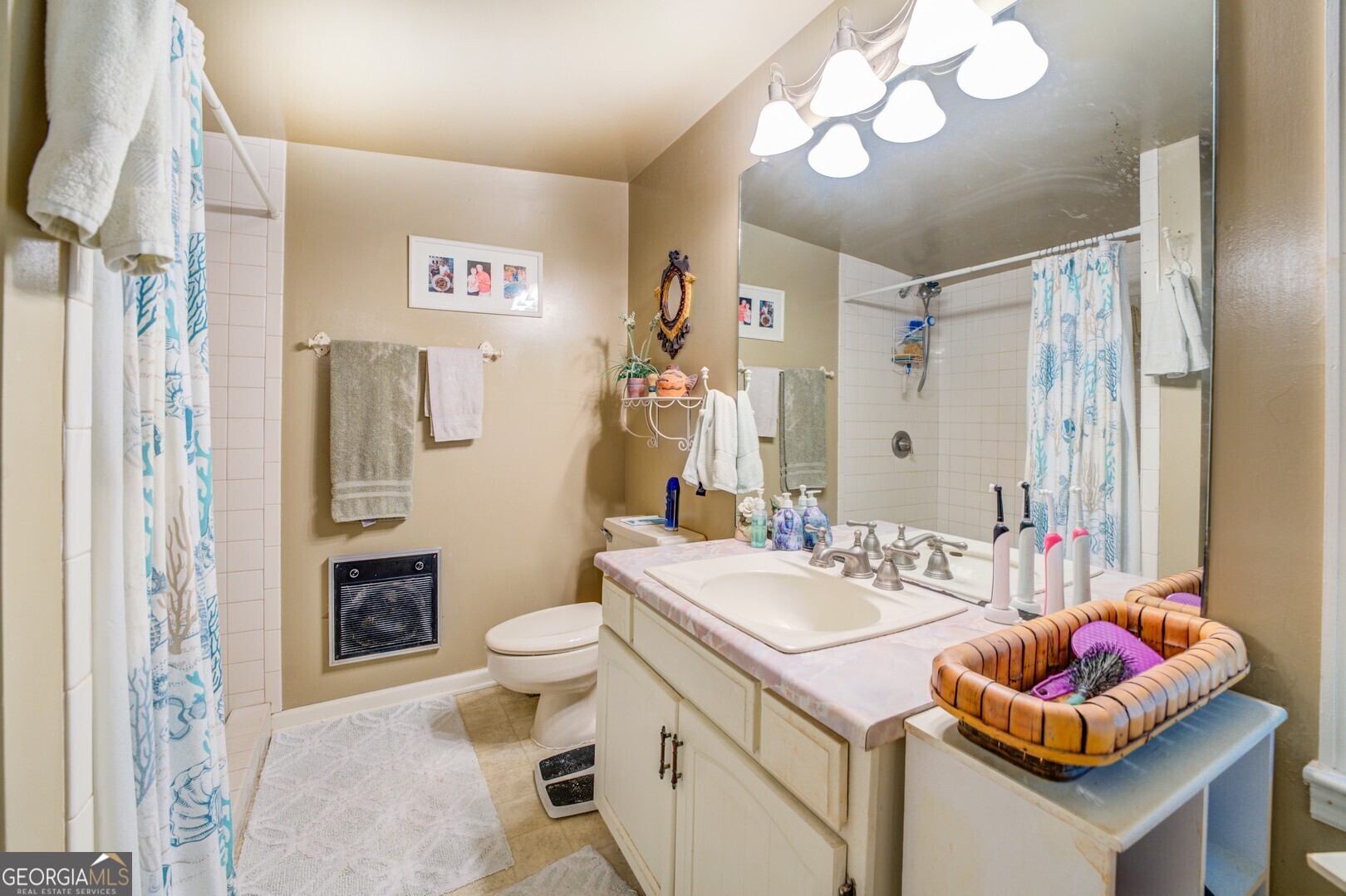 766 Raven Road Monticello, GA 31064 - Photo 43 of 59 a bathroom with a sink toilet and shower