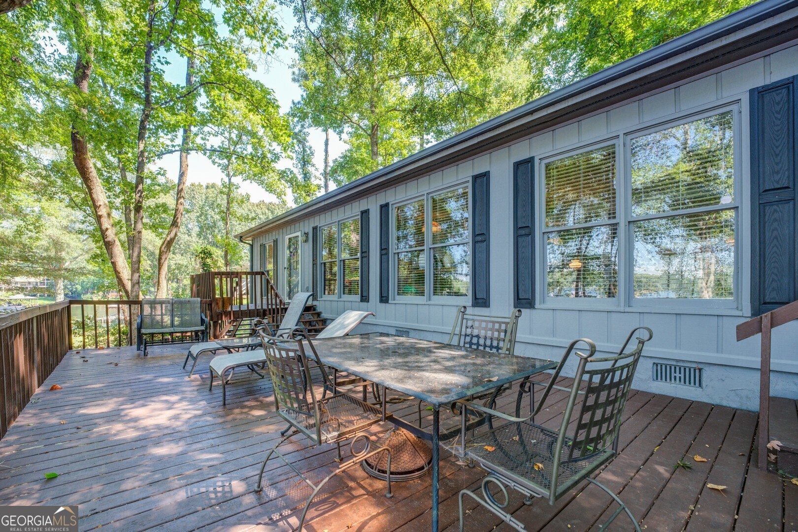 766 Raven Road Monticello, GA 31064 - Photo 46 of 59 a view of patio with table and chairs and wooden floor