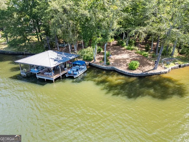 an outdoor view of swimming pool with lounge chair
