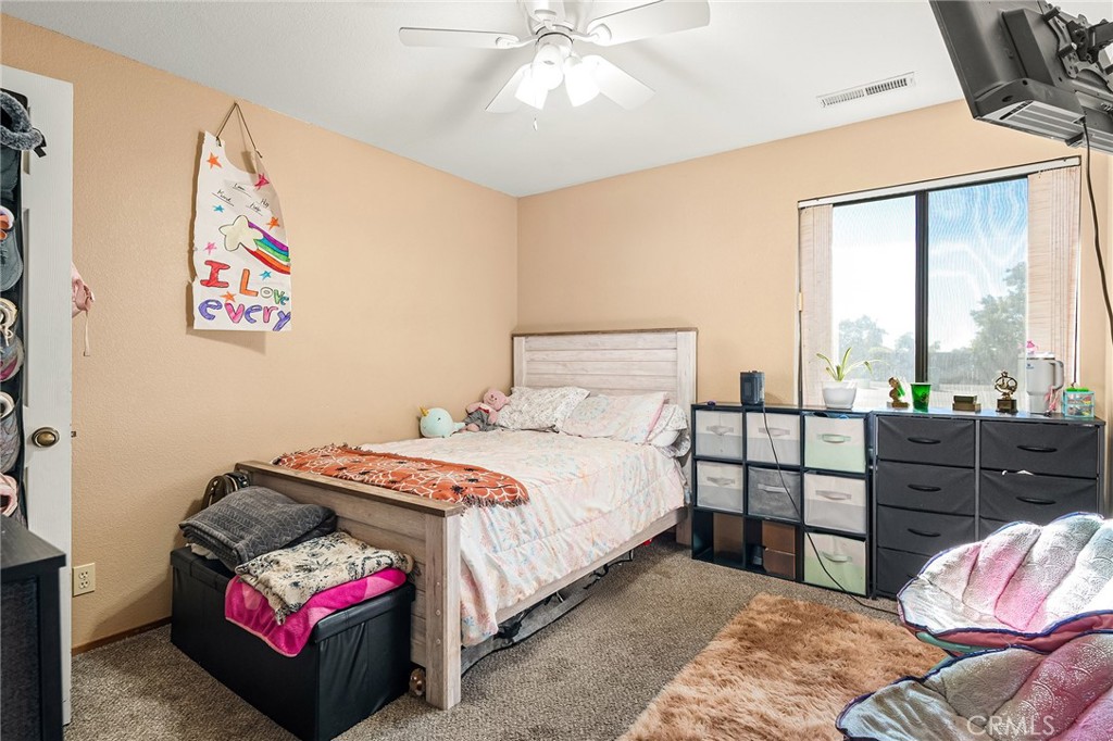 631 North Street Corning, CA 96021 - Photo 18 of 39 a bedroom with a bed and a window