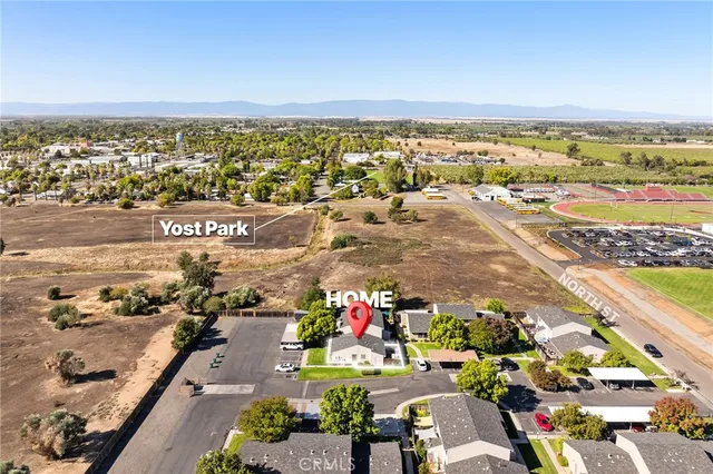 an aerial view of houses with outdoor space