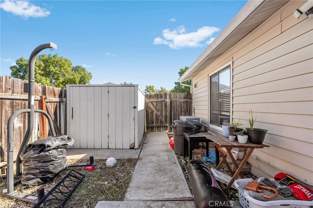 631 North Street Corning, CA 96021 - Photo 39 of 39 a view of a patio with table and chairs with wooden fence