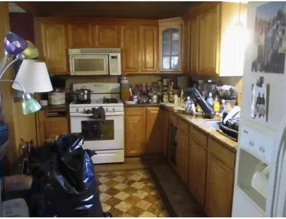 a kitchen with a stove a sink a microwave and cabinets