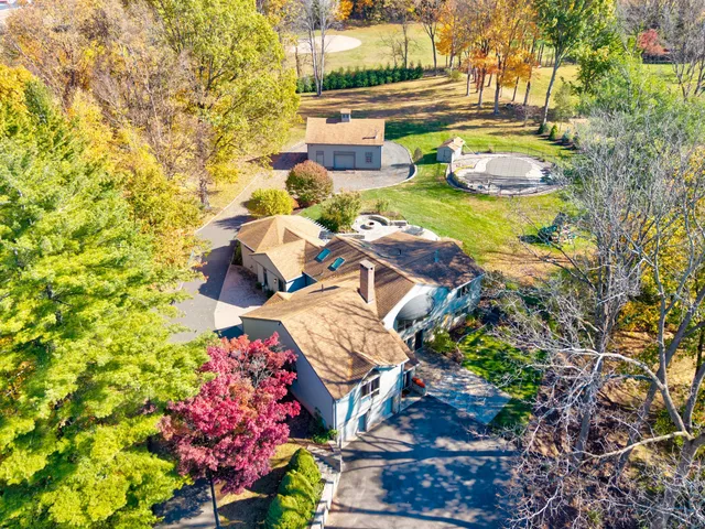 a view of swimming pool with outdoor seating and plants