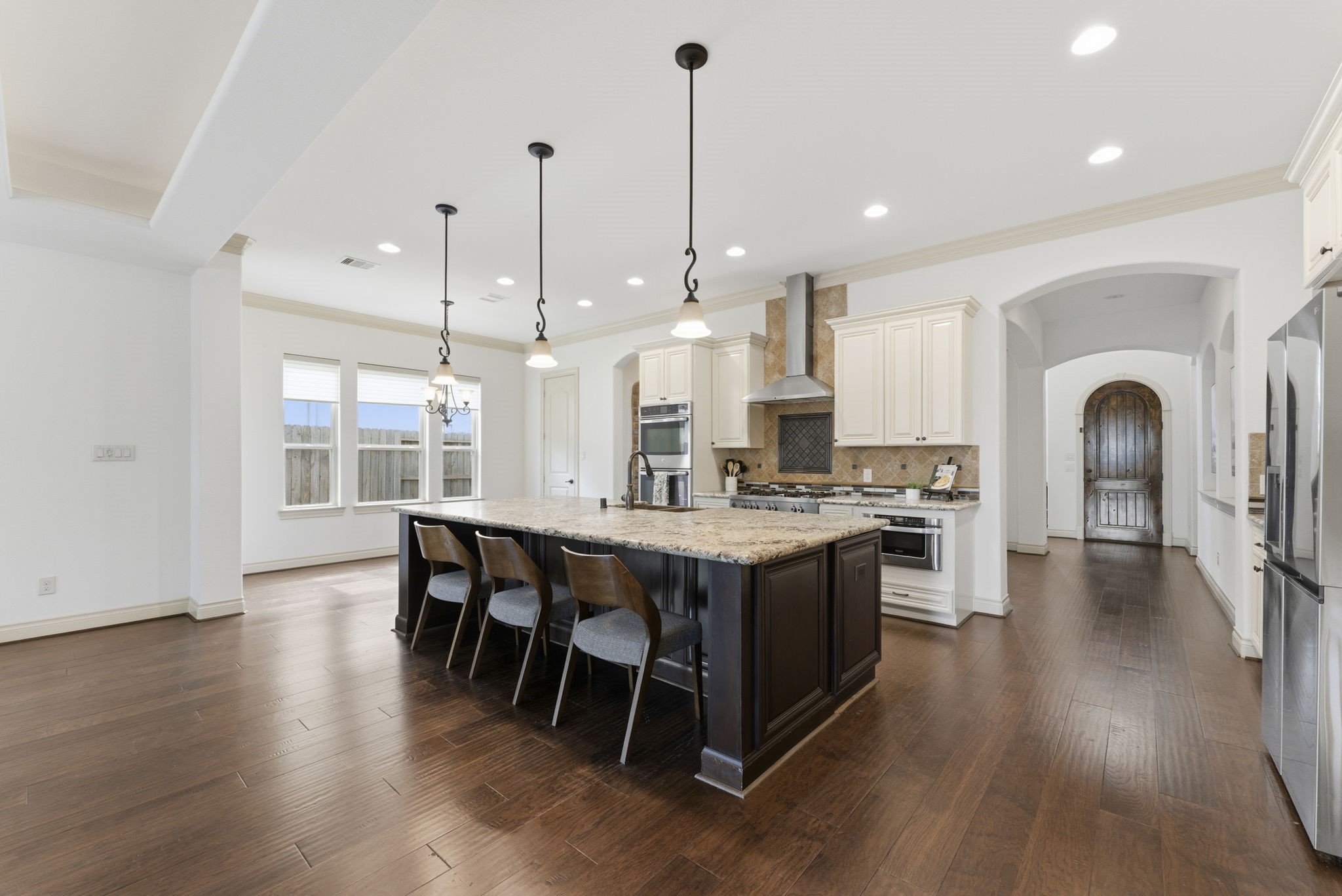 26006 Carolina Cherry Court Spring, TX 77389 - Photo 15 of 50 a large kitchen with lots of counter space a sink appliances and dining table