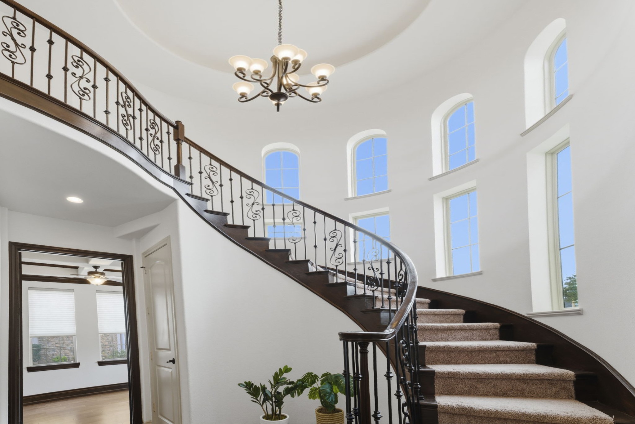 26006 Carolina Cherry Court Spring, TX 77389 - Photo 5 of 50 a view of staircase with lots of frames on wall and a chandelier