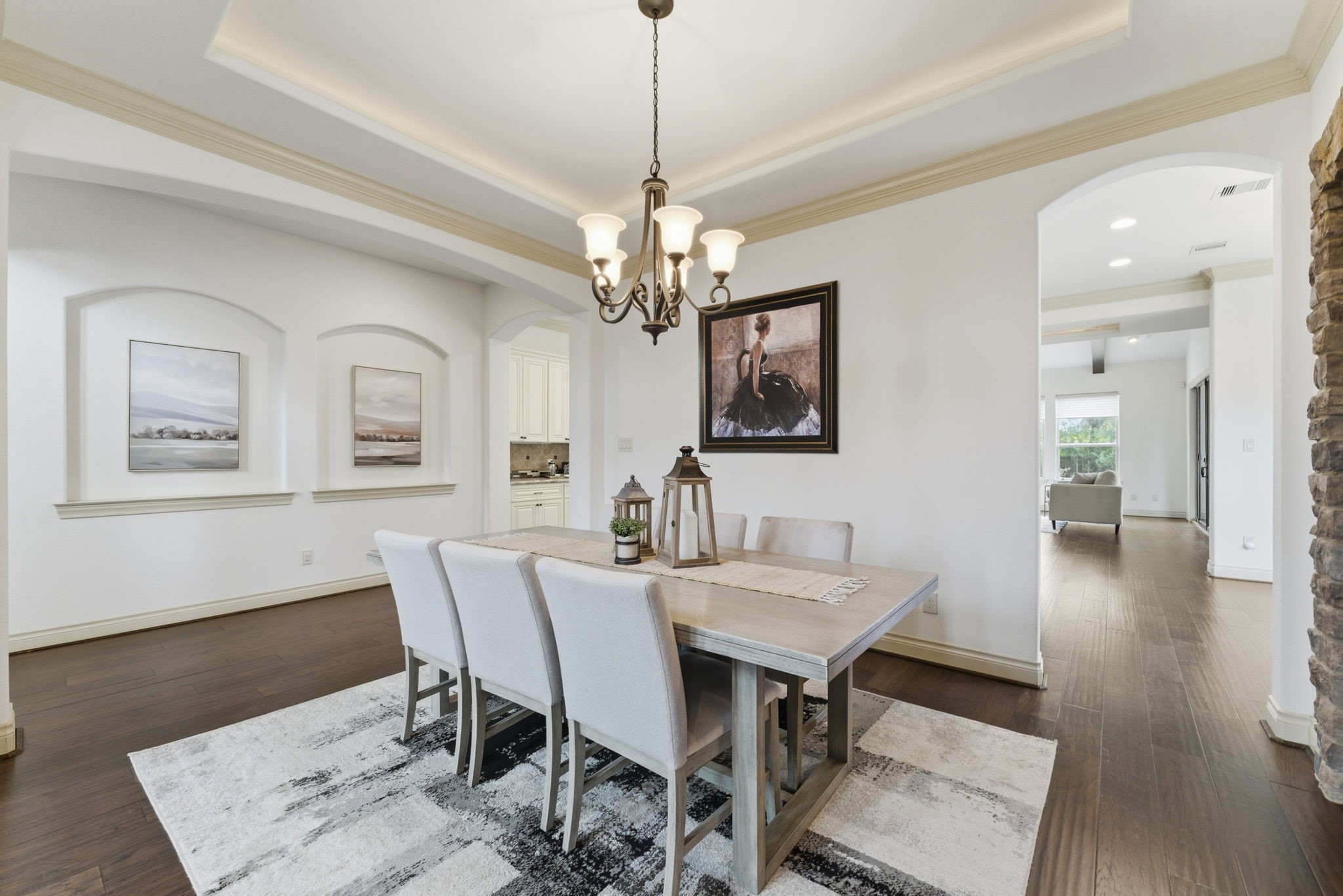 26006 Carolina Cherry Court Spring, TX 77389 - Photo 7 of 50 a view of a dining room with furniture a chandelier and wooden floor