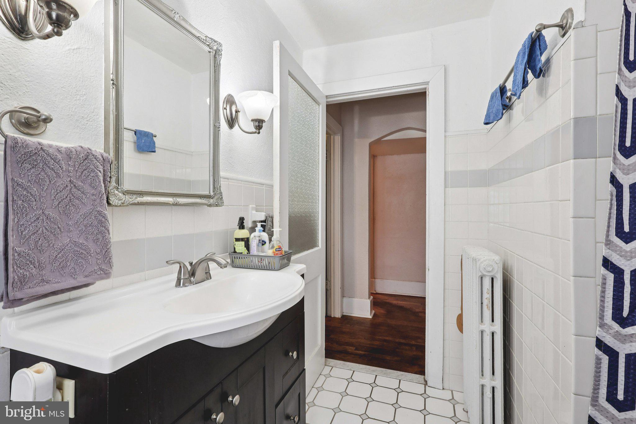 285 Watson Avenue Hamilton, NJ 08610 - Photo 13 of 18 a bathroom with a sink a toilet and shower