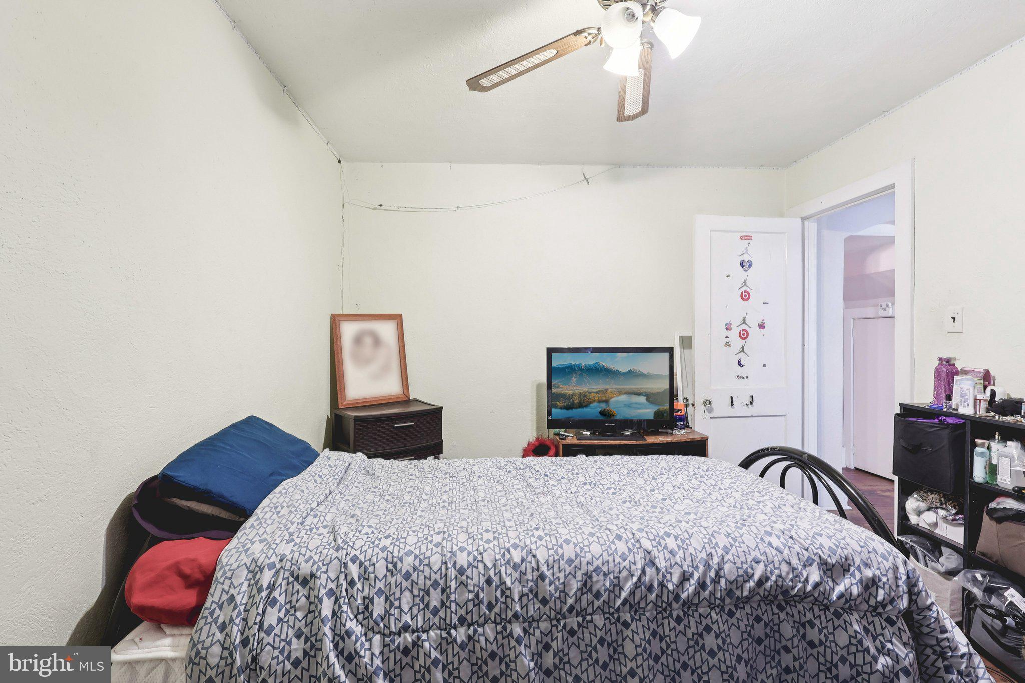 285 Watson Avenue Hamilton, NJ 08610 - Photo 17 of 18 a bedroom with a bed and wooden floor