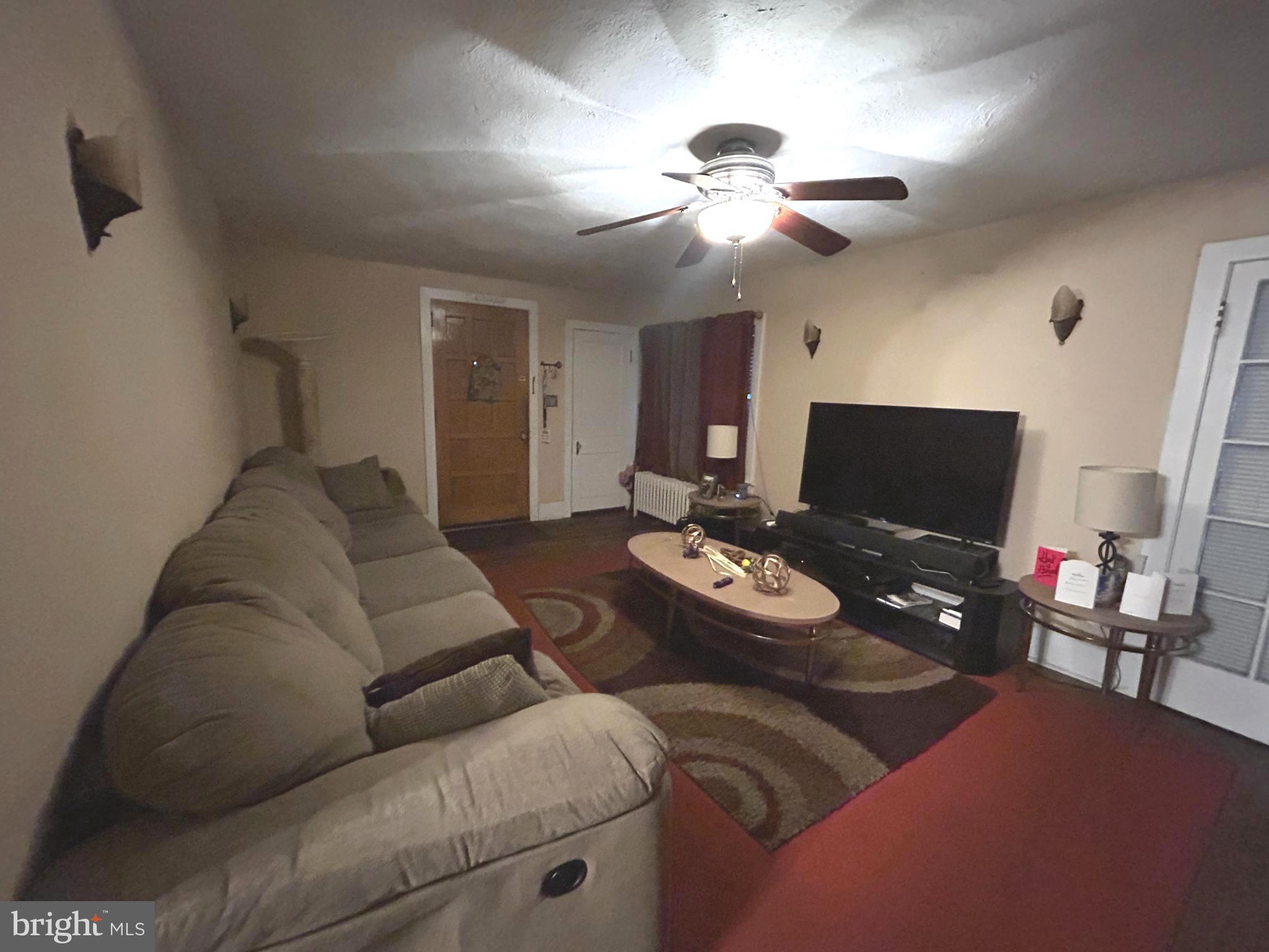 285 Watson Avenue Hamilton, NJ 08610 - Photo 3 of 11 a living room with furniture and wooden floor