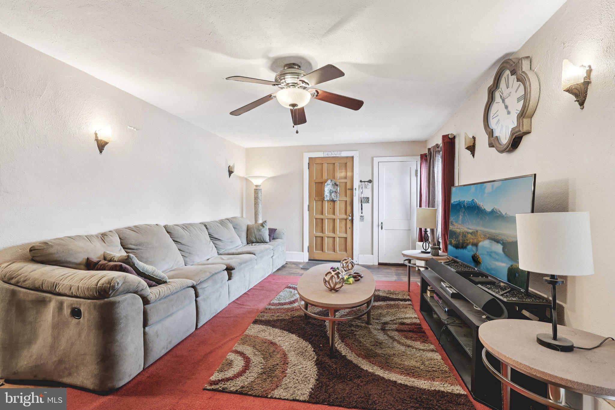 285 Watson Avenue Hamilton, NJ 08610 - Photo 3 of 18 a living room with furniture and a lamp