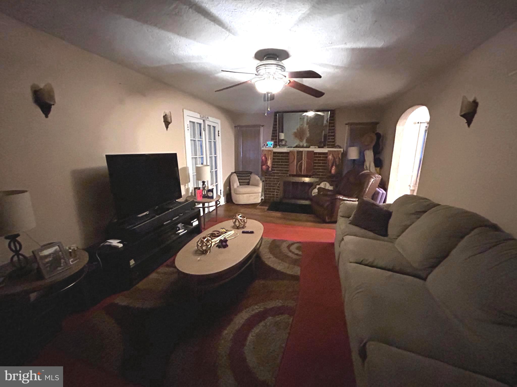 285 Watson Avenue Hamilton, NJ 08610 - Photo 4 of 11 a living room with furniture and a flat screen tv