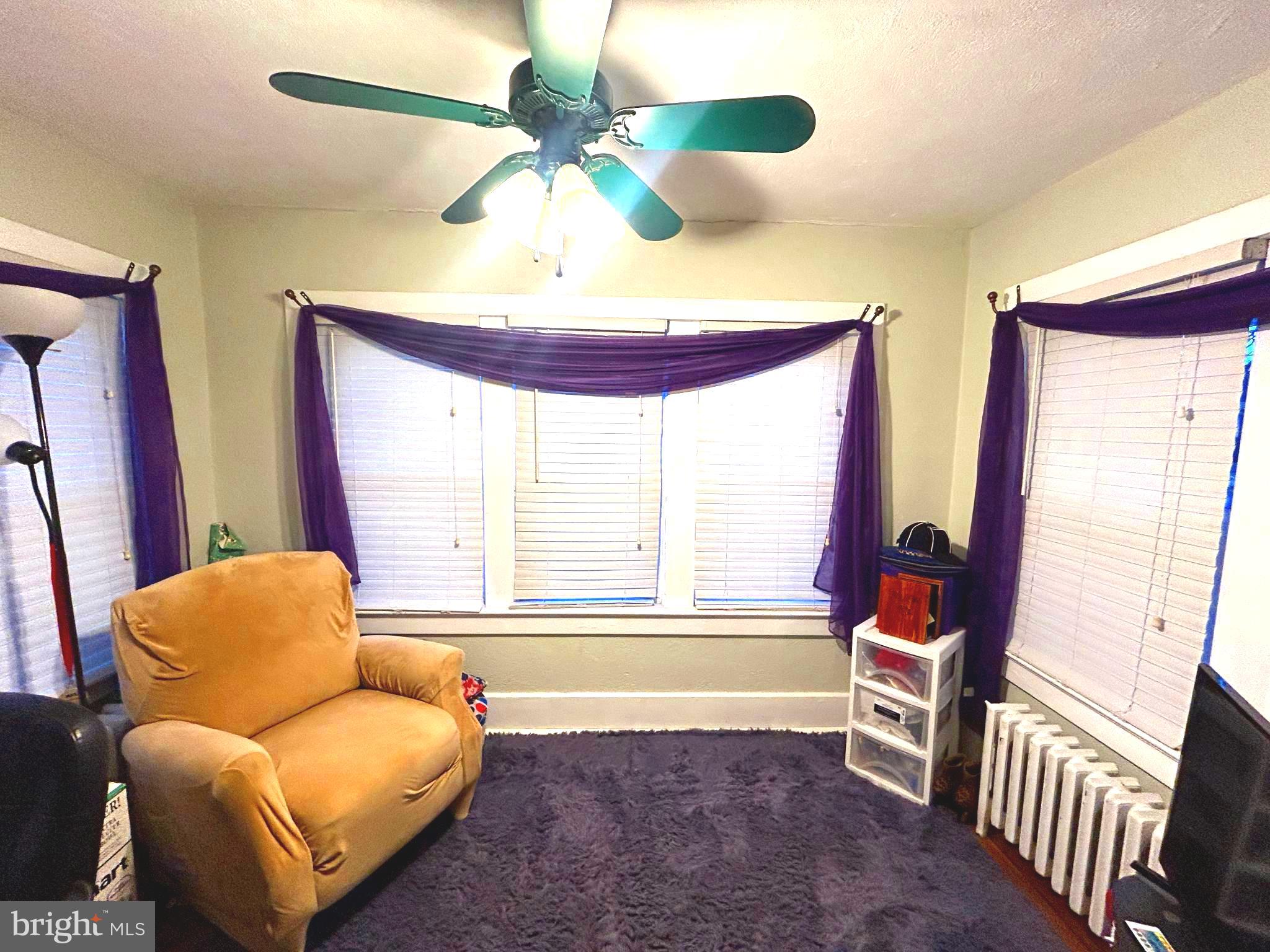 285 Watson Avenue Hamilton, NJ 08610 - Photo 5 of 18 a living room with furniture and a large window