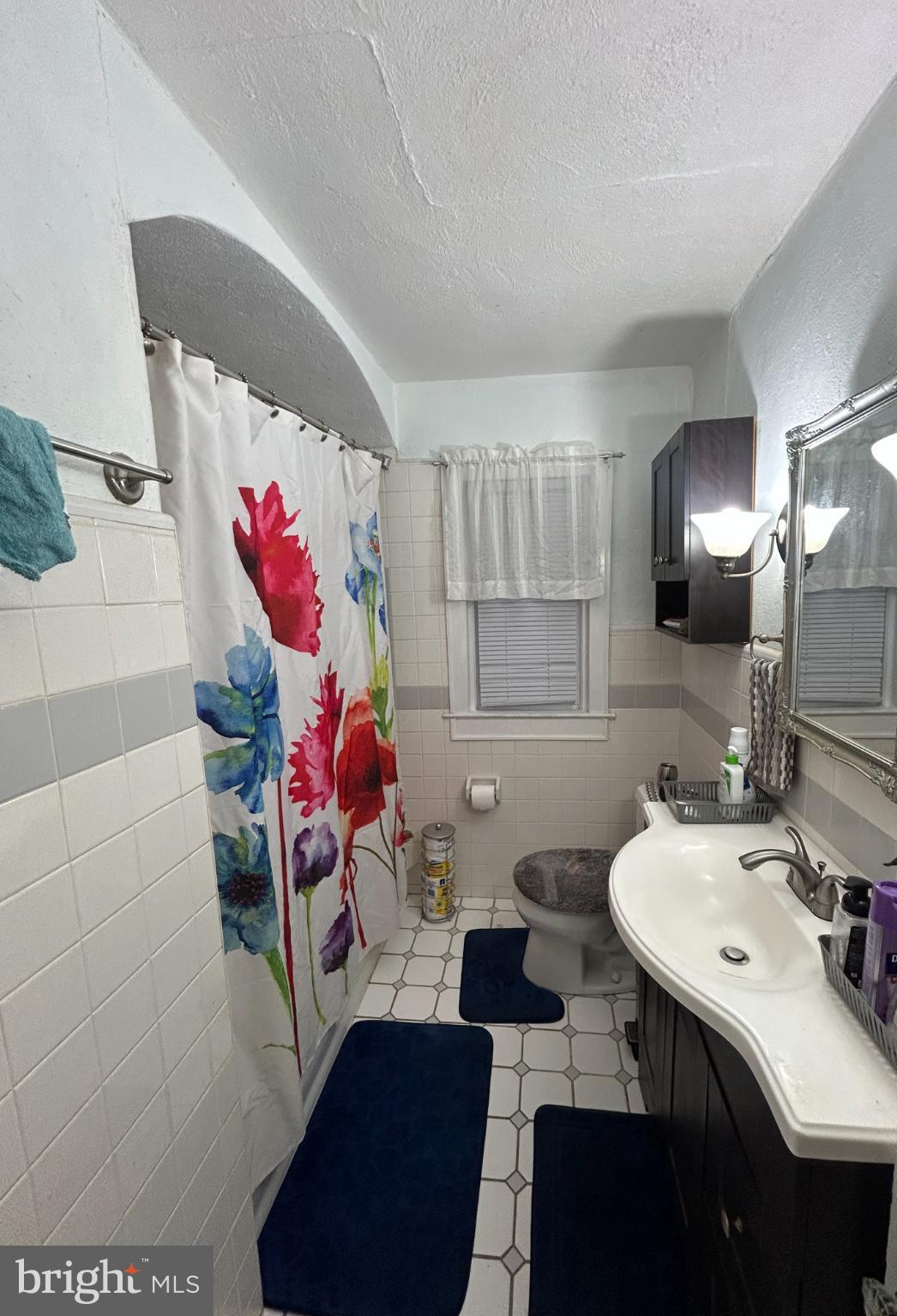 285 Watson Avenue Hamilton, NJ 08610 - Photo 10 of 11 a bathroom with a sink mirror and vanity
