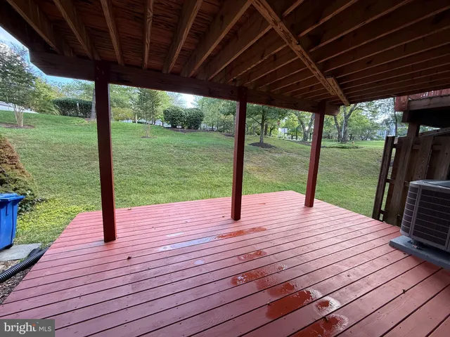 a patio with wooden floor yard