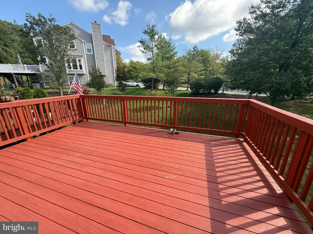 a balcony with view of trees in the background
