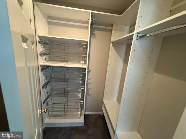 a bathroom with a glass door shower and a sink