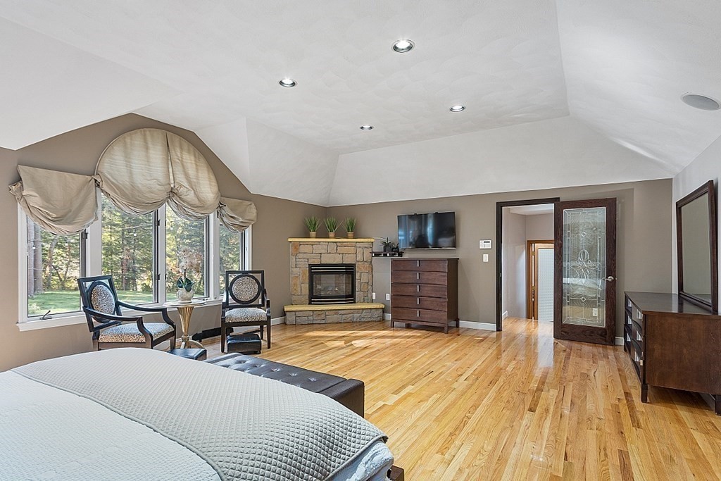 24 Powers Road Andover, MA 01810 - Photo 20 of 42 a living room with furniture fireplace and wooden floor