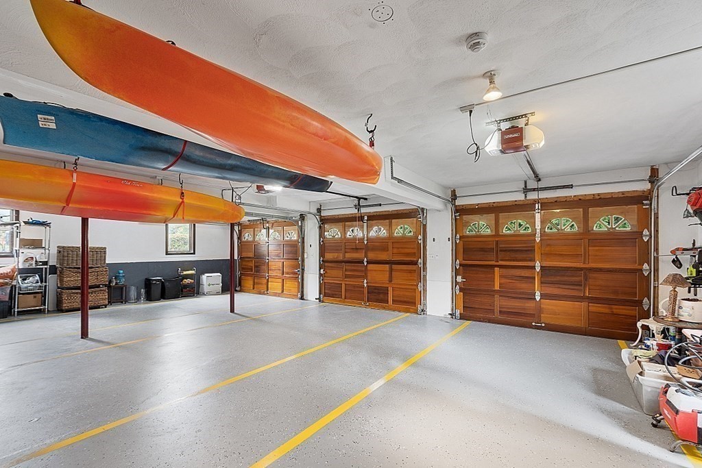 24 Powers Road Andover, MA 01810 - Photo 39 of 42 a view of a room with gym equipment and large windows