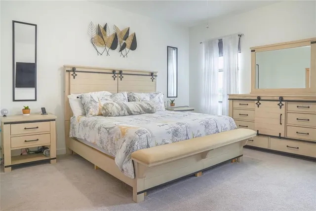 a bedroom with a bed and window