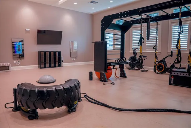 a bedroom with furniture and a baby crib