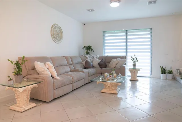 a living room with patio and a couch