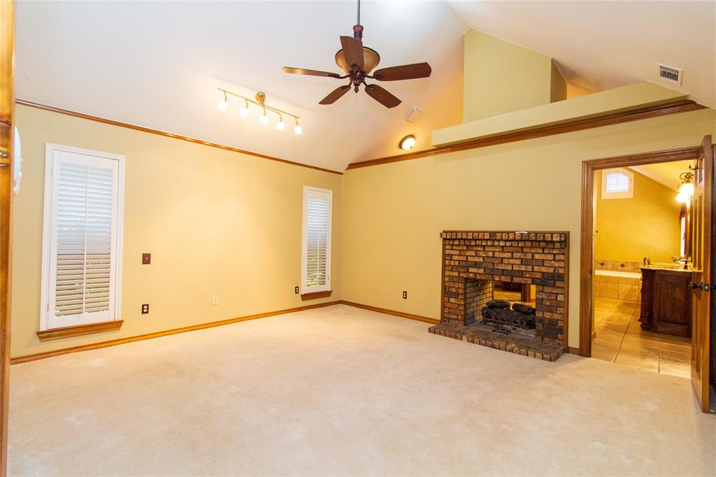 3014 Pecan Ridge Drive Rowlett, TX 75088 - Photo 17 of 29 a view of an empty room with a fireplace