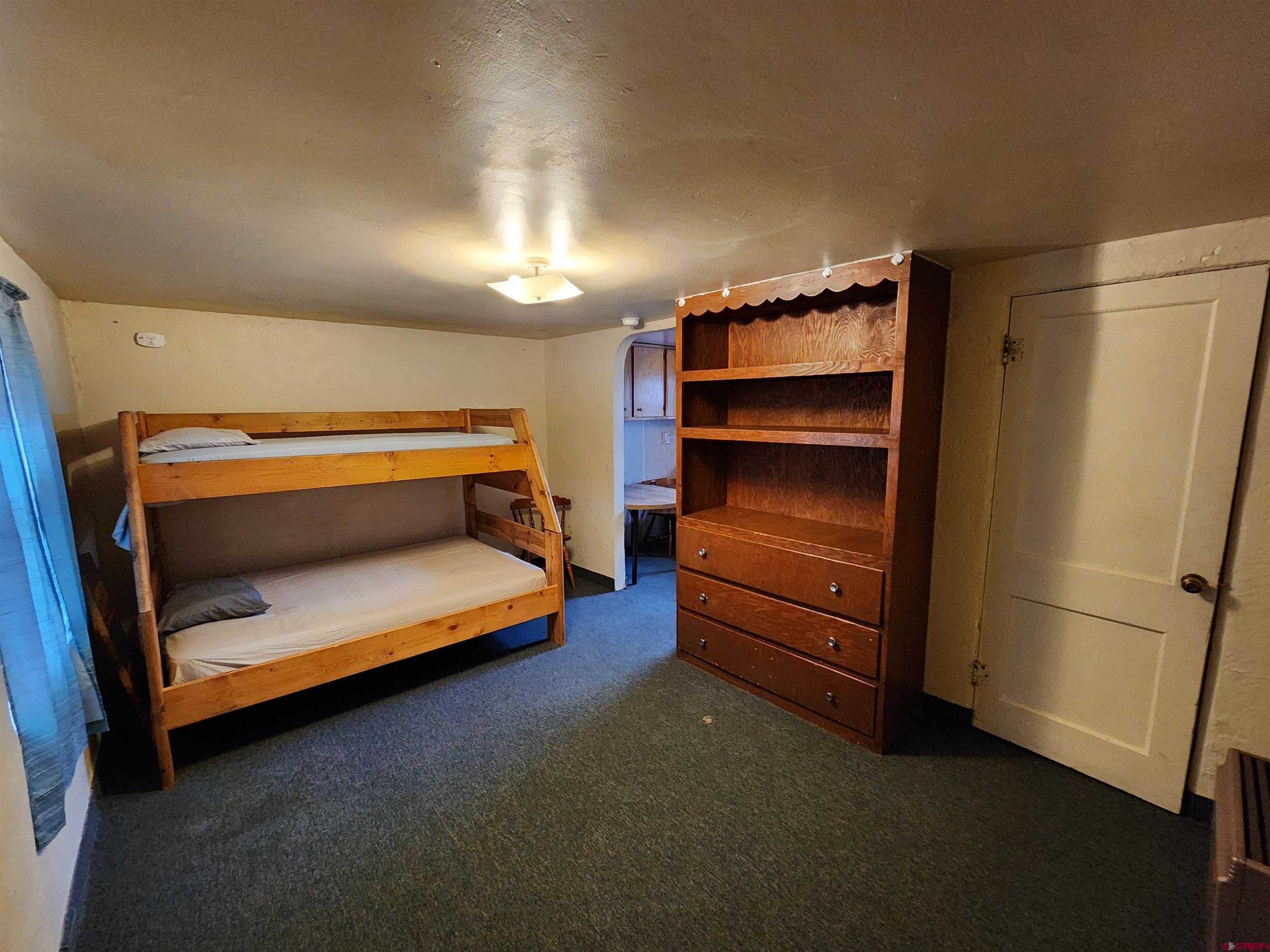 11977 US Highway 285 Center, CO 81125 - Photo 11 of 16 a empty room with a fireplace