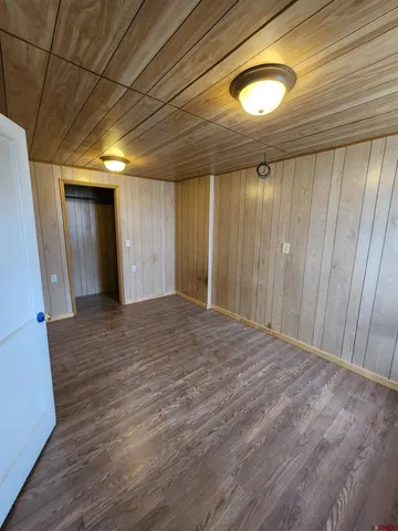 a view of hallway with wooden floor