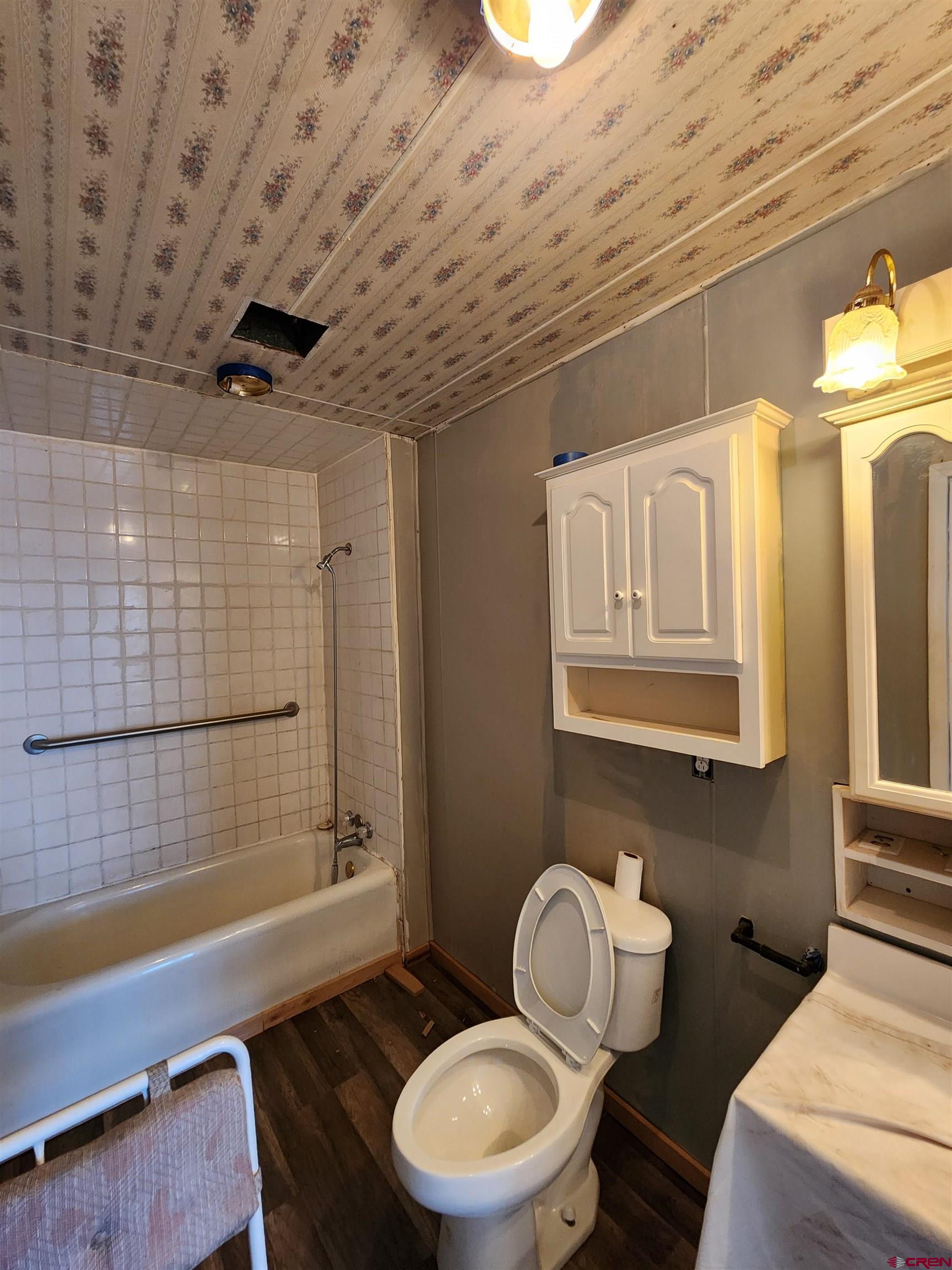 11977 US Highway 285 Center, CO 81125 - Photo 8 of 16 a bathroom with a sink a toilet and shower