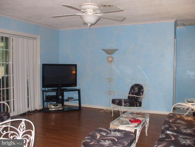 5007 Decatur Street St. Leonard, MD 20685 - Photo 17 of 17 a living room with furniture and a flat screen tv
