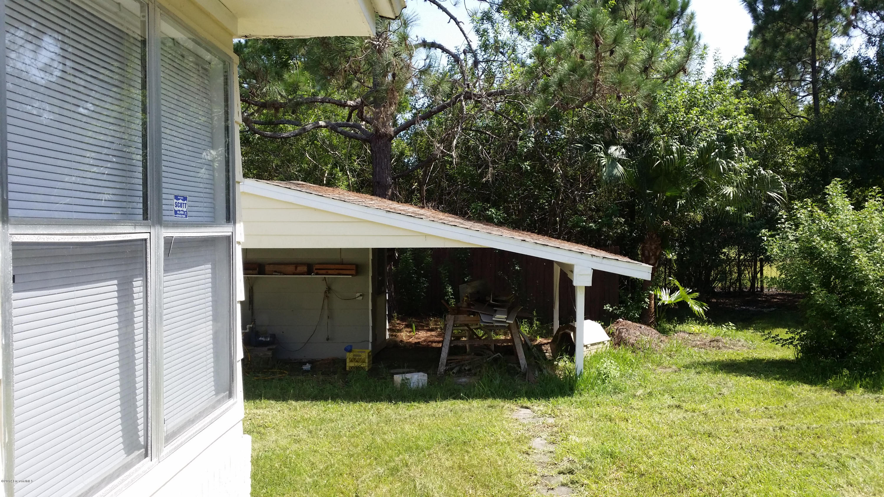 3800 Corey Road Grant Valkaria, FL 32950 - Photo 2 of 9 Covered Work Area
