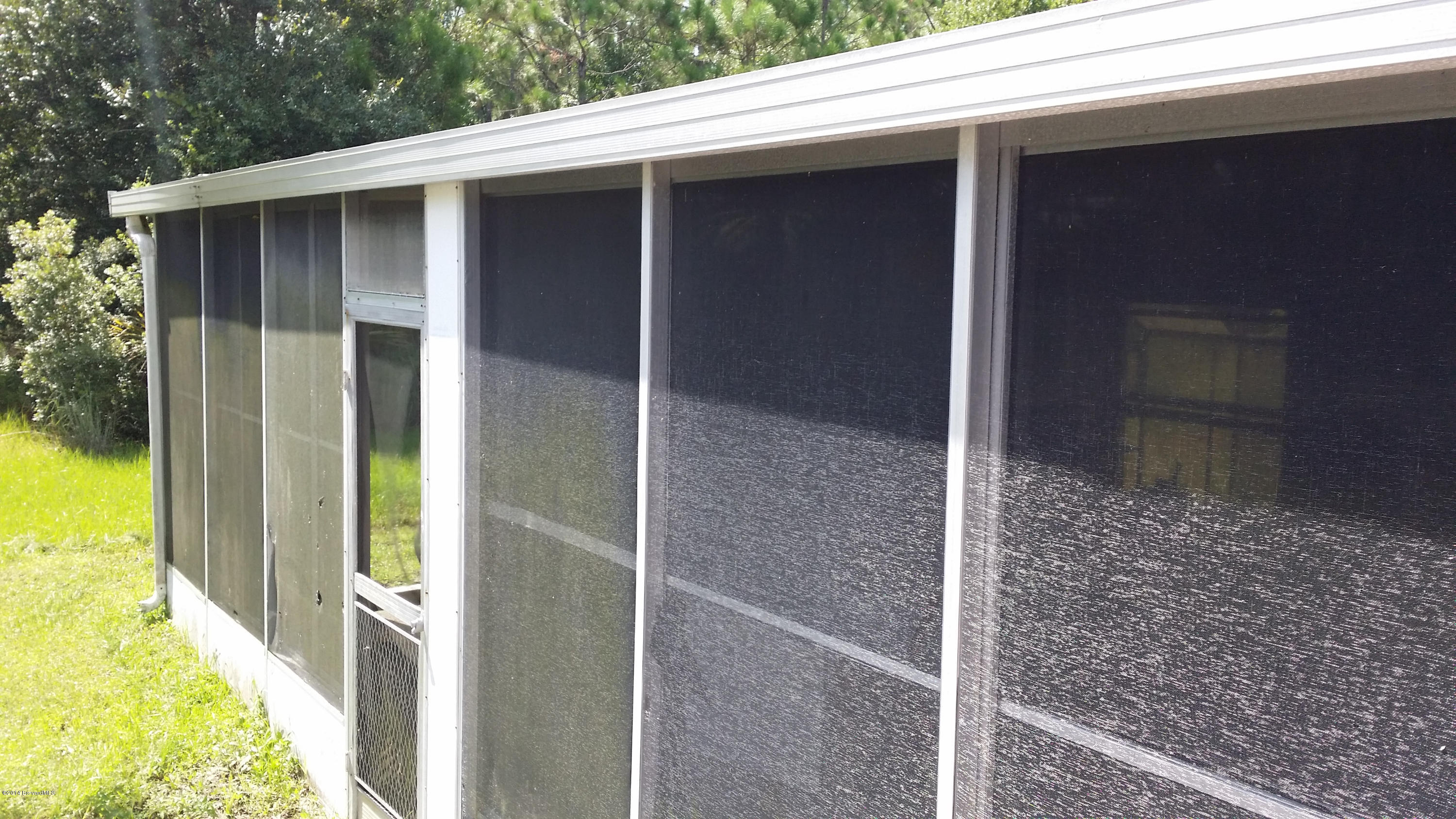 3800 Corey Road Grant Valkaria, FL 32950 - Photo 6 of 9 Screened Patio
