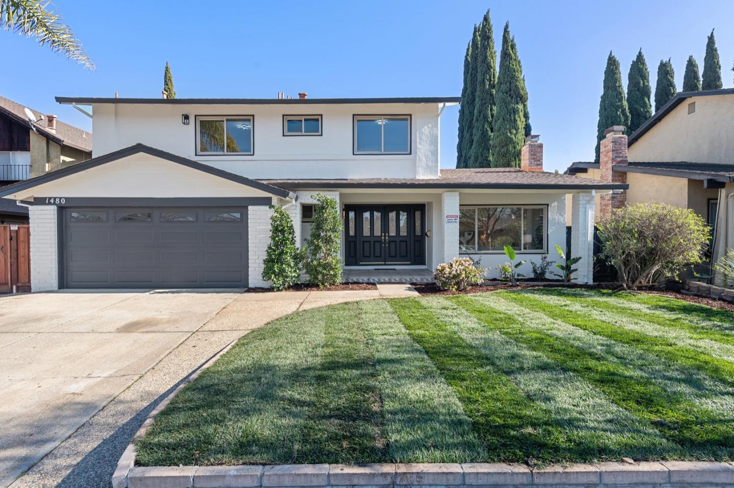 front view of a house with a yard