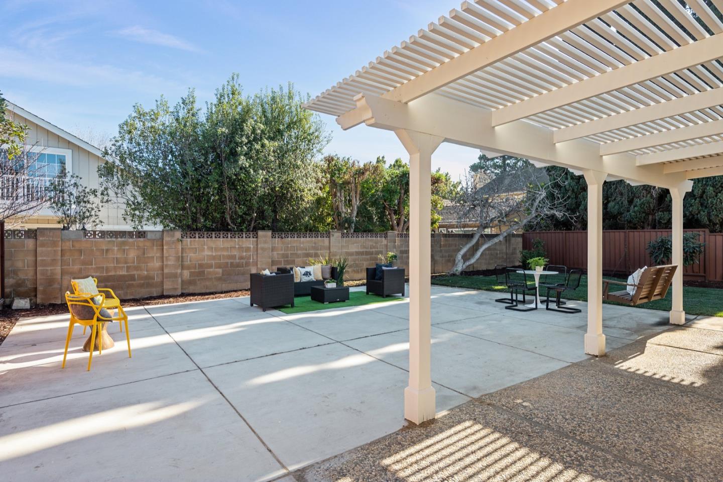 1480 Mallard Way Sunnyvale, CA 94087 - Photo 5 of 5 a view of a patio with table and chairs potted plants with wooden fence