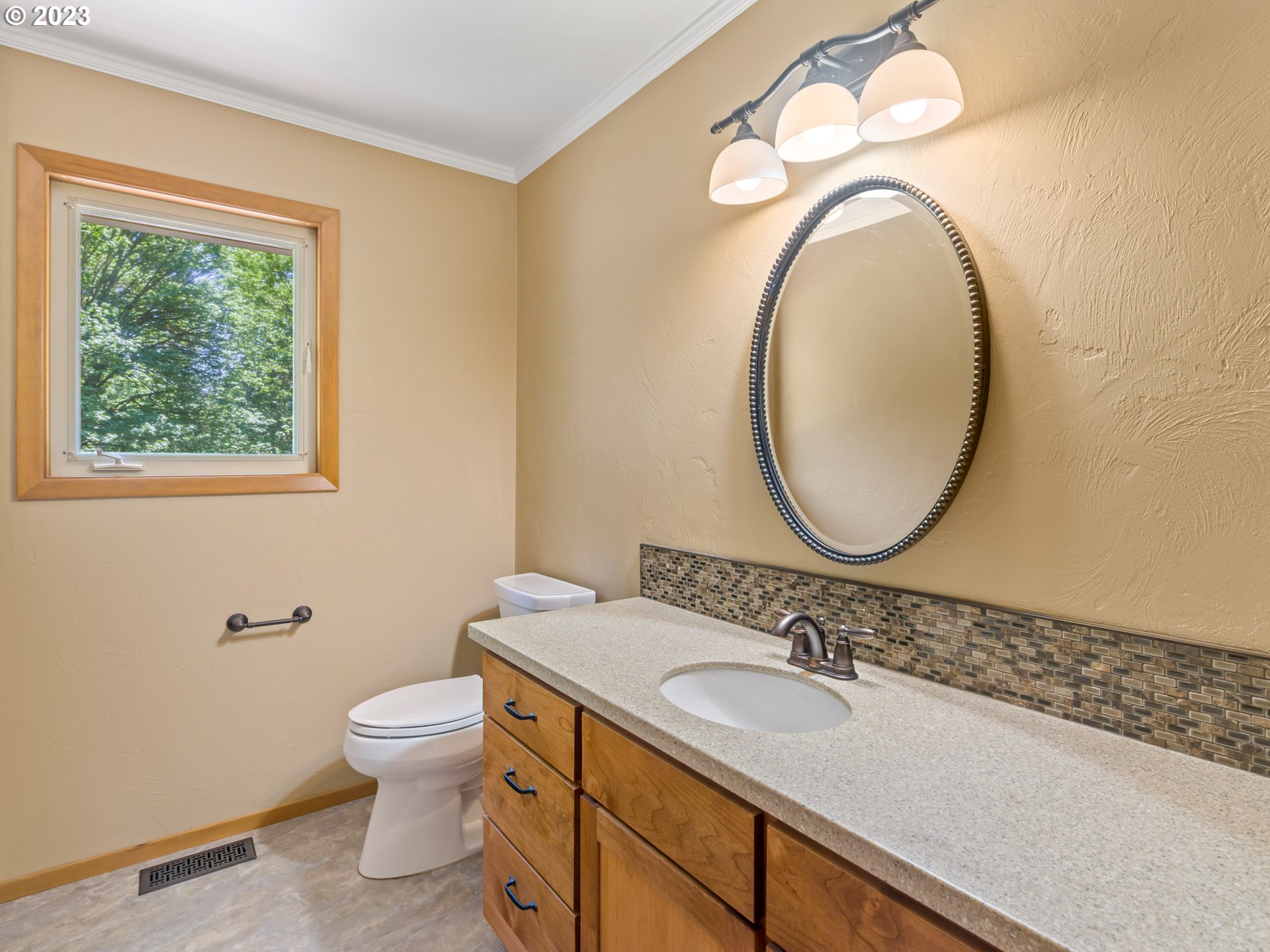 88601 Ermi Bee Road Springfield, OR 97478 - Photo 23 of 48 a bathroom with a granite countertop toilet a sink and a mirror