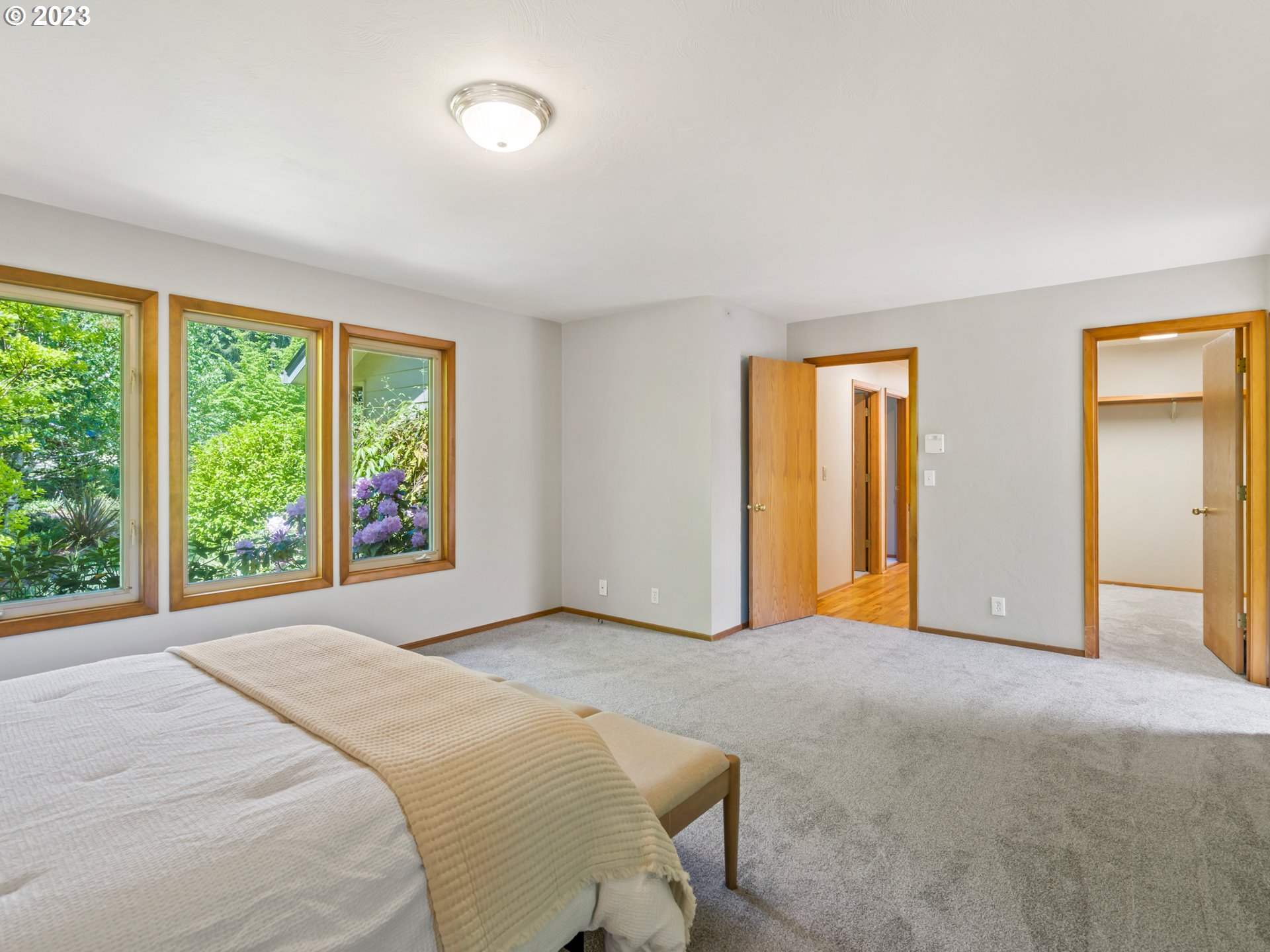 88601 Ermi Bee Road Springfield, OR 97478 - Photo 26 of 48 a bedroom with a large bed and a large window