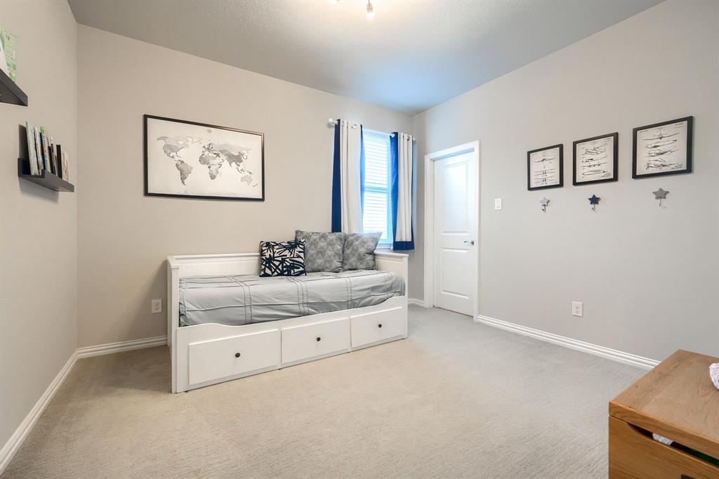 1436 Pebble Way Allen, TX 75013 - Photo 19 of 35 a room with a bed and a cabinets