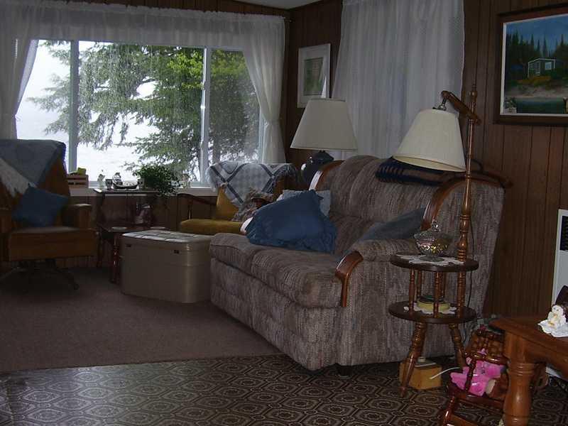 194 Cedar Lake Road Millinocket, ME 04462 - Photo 8 of 30 Living Room. The living room offers...