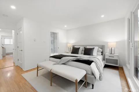 a bedroom with bed and a table