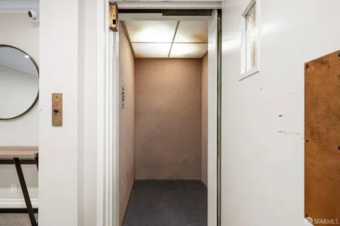 a view of hallway with washer and dryer