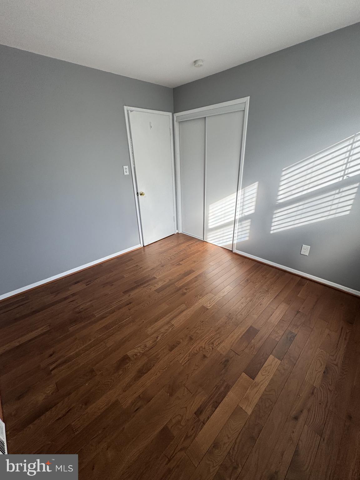7410 Dickenson Street Springfield, VA 22150 - Photo 7 of 14 Bright and airy room with hardwood floors.