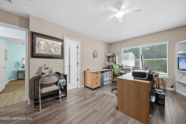 a room with furniture and wooden floor
