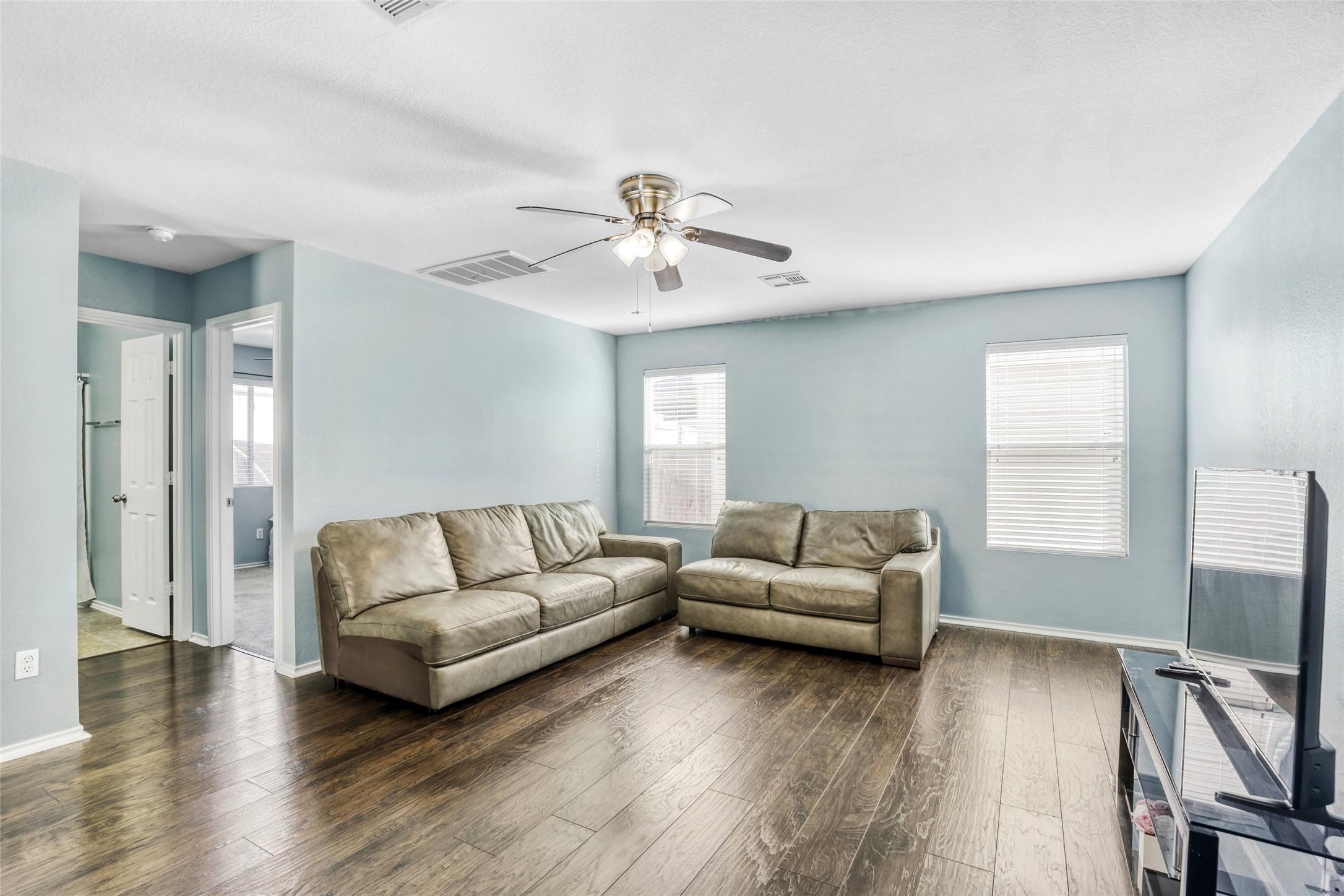 5624 Colinton Avenue Austin, TX 78754 - Photo 12 of 38 Living room with ceiling fan and dark wood finished floors