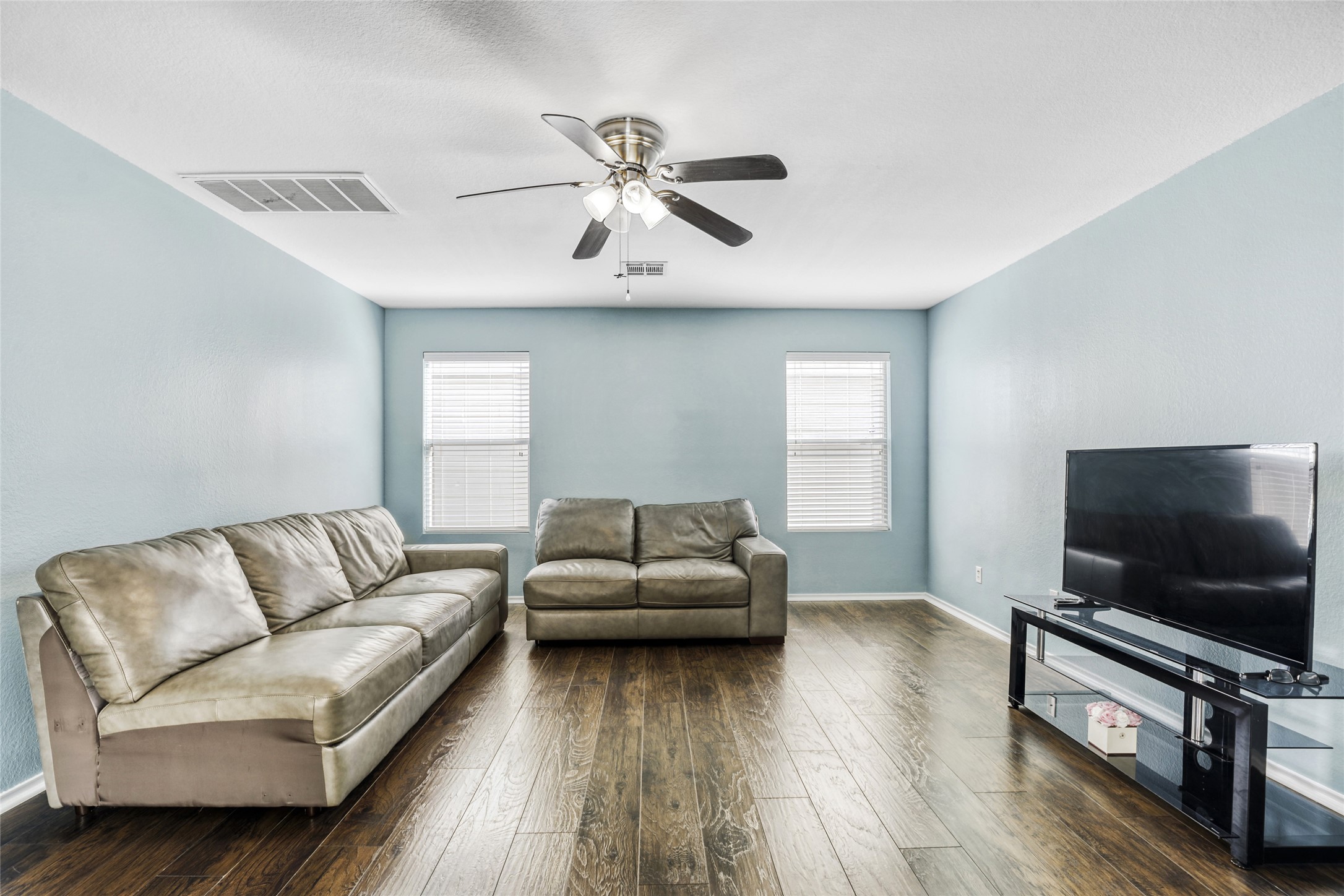 5624 Colinton Avenue Austin, TX 78754 - Photo 13 of 38 Living area featuring dark wood-type flooring and ceiling fan