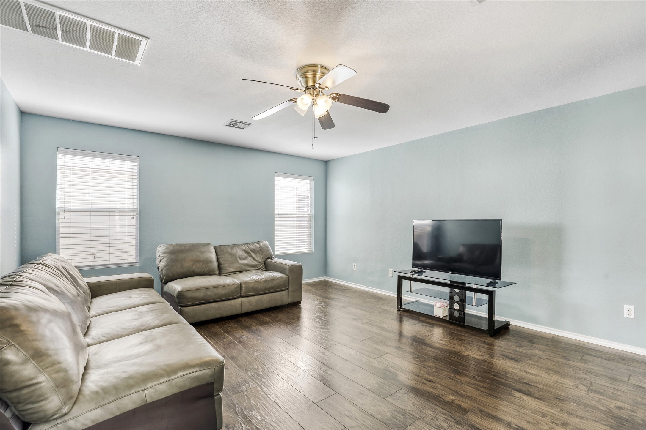 5624 Colinton Avenue Austin, TX 78754 - Photo 14 of 38 Living area featuring a ceiling fan and dark wood finished floors