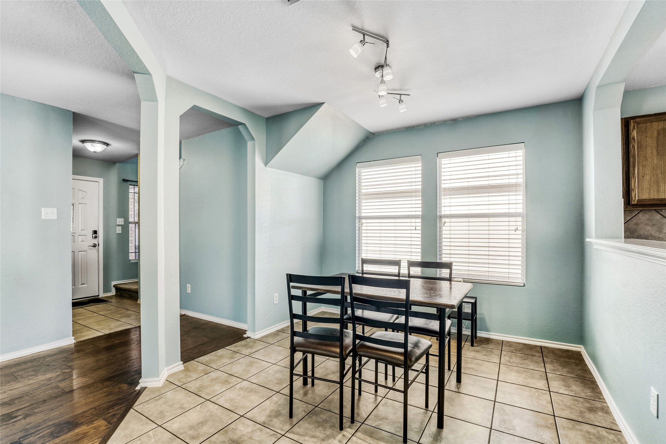 5624 Colinton Avenue Austin, TX 78754 - Photo 18 of 38 Dining area featuring light tile patterned flooring, a textured ceiling, and track lighting