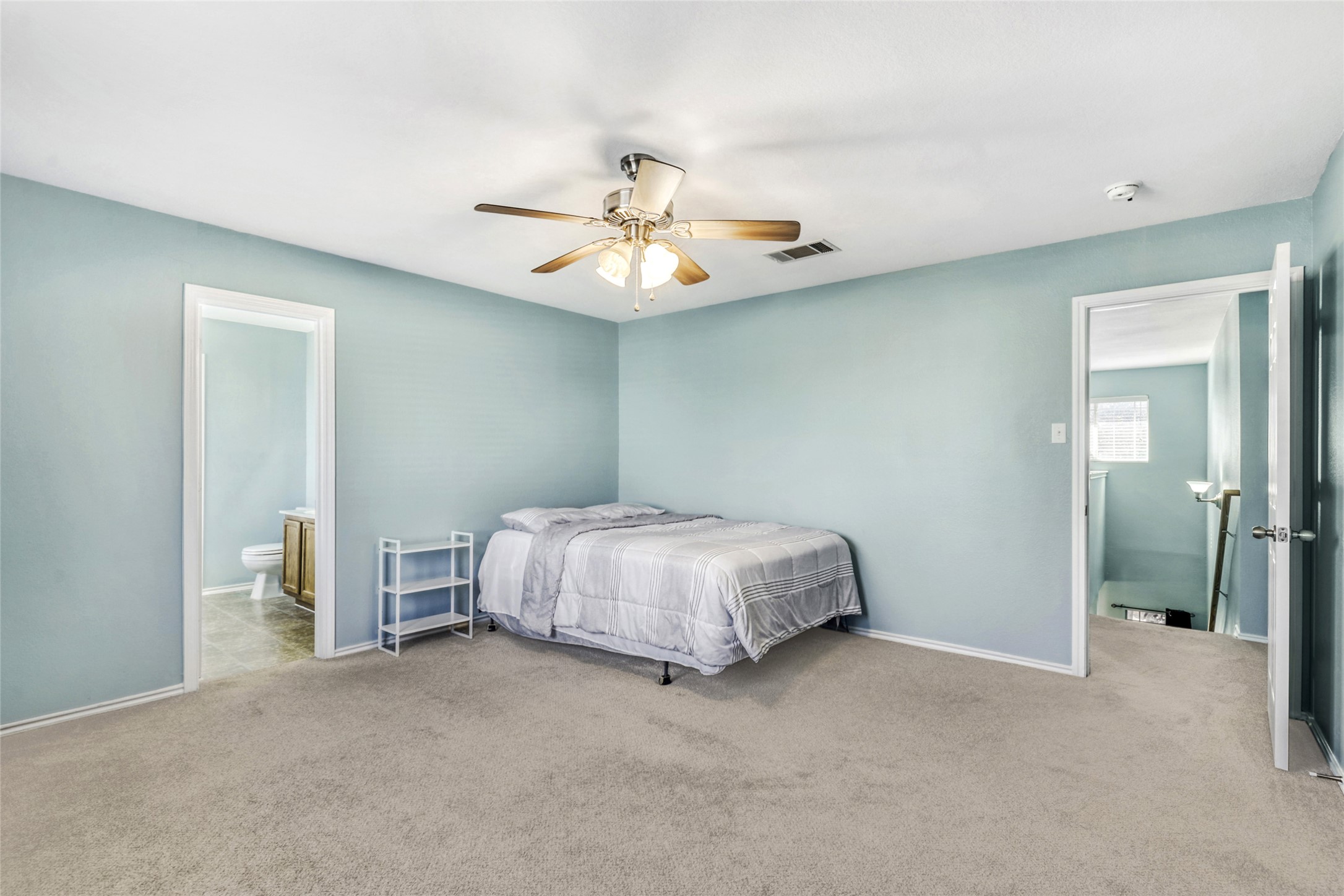 5624 Colinton Avenue Austin, TX 78754 - Photo 22 of 38 Primary Bedroom featuring carpet floors, ceiling fan, and ensuite bathroom